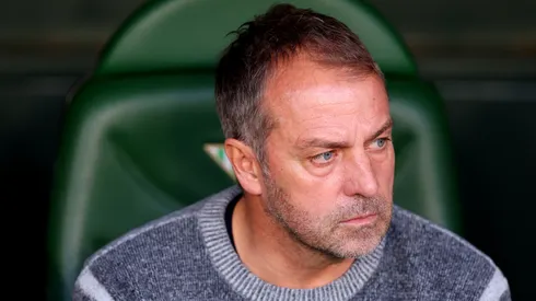 Hansi Flick, Head Coach of FC Barcelona, looks on prior to the LaLiga match between Real Betis Balompie and FC Barcelona at Estadio Benito Villamarin on December 07, 2024 in Seville, Spain.