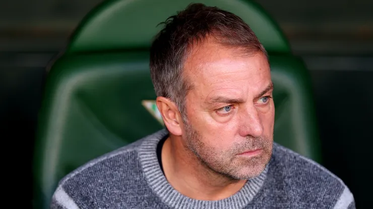 Hansi Flick, Head Coach of FC Barcelona, looks on prior to the LaLiga match between Real Betis Balompie and FC Barcelona at Estadio Benito Villamarin on December 07, 2024 in Seville, Spain.