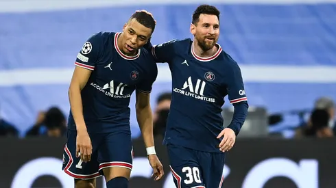 Kylian Mbappe of Paris Saint-Germain celebrates after scoring his team's first goal with Lionel Messi of Paris Saint-Germain during the UEFA Champions League Round Of Sixteen Leg Two match between Real Madrid and Paris Saint-Germain at Estadio Santiago Bernabeu on March 09, 2022 in Madrid, Spain.