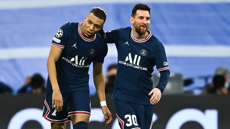 Kylian Mbappe of Paris Saint-Germain celebrates after scoring his team's first goal with Lionel Messi of Paris Saint-Germain during the UEFA Champions League Round Of Sixteen Leg Two match between Real Madrid and Paris Saint-Germain at Estadio Santiago Bernabeu on March 09, 2022 in Madrid, Spain.
