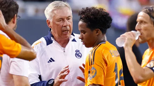 Real Madrid head coach Carlo Ancelotti talks to Endrick 16 during the preseason friendly against AC Milan on July 31, 2024 at Soldier Field in Chicago, Illinois.