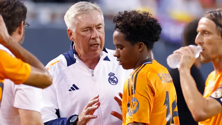 Real Madrid head coach Carlo Ancelotti talks to Endrick 16 during the preseason friendly against AC Milan on July 31, 2024 at Soldier Field in Chicago, Illinois.