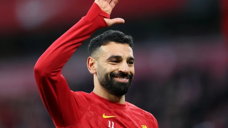 Mohamed Salah of Liverpool waves to fans as he warms up prior to the Premier League match between Liverpool FC and Manchester City FC at Anfield on December 01, 2024 in Liverpool, England.