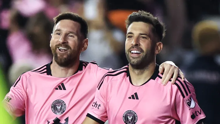 Lionel Messi #10 of Inter Miami celebrates with Jordi Alba #18 after scoring his second goal during the second half against the New England Revolution at Chase Stadium on October 19, 2024 in Fort Lauderdale, Florida.