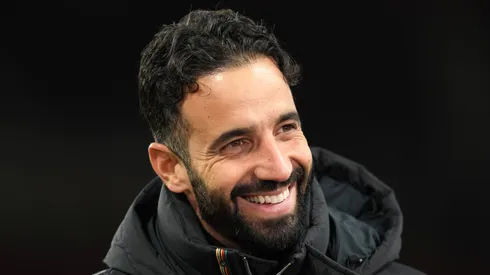 Manchester United head coach Ruben Amorim smiling.