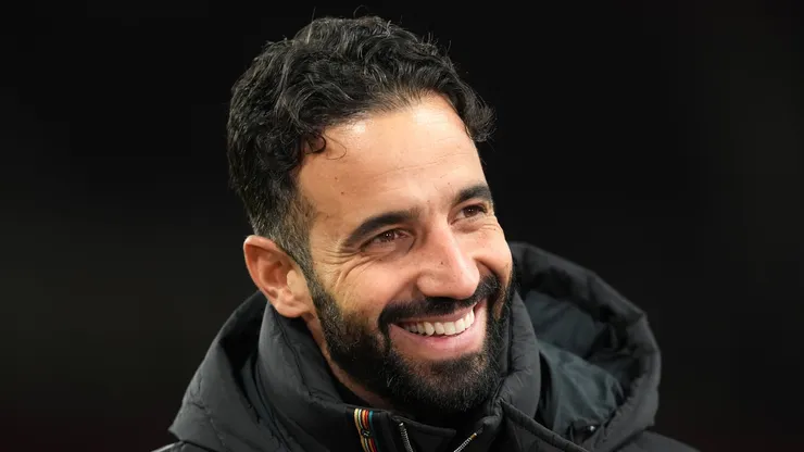 Manchester United head coach Ruben Amorim smiling.