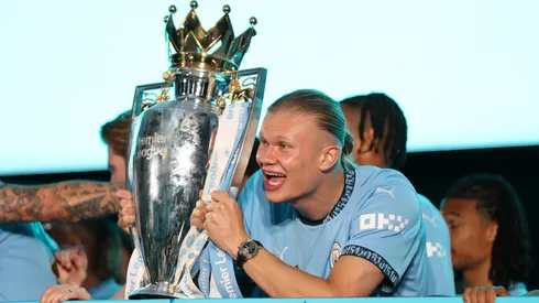 : Erling Haaland of Manchester City celebrates with the Premier League trophy during the Manchester City trophy parade on May 26, 2024 in Manchester, England.