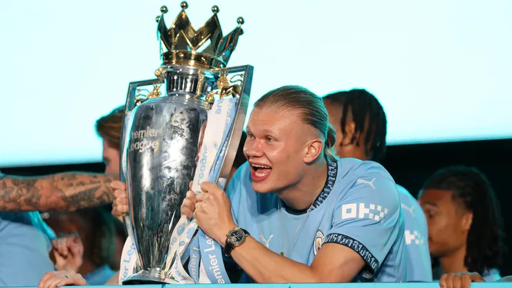 : Erling Haaland of Manchester City celebrates with the Premier League trophy during the Manchester City trophy parade on May 26, 2024 in Manchester, England.