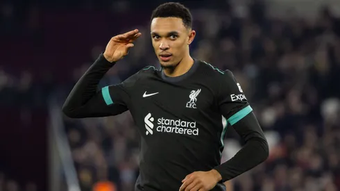 Trent Alexander-Arnold (Liverpool FC) celebrates after scoring with a hand gesture indicating gossip about a prospective move abroad at The London Stadium.