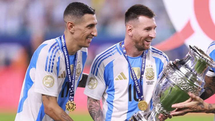 Angel Di Maria, Lionel Messi and Nicolas Otamendi of Argentina celebrate with the trophy after the team's victory in the CONMEBOL Copa America 2024 Final match between Argentina and Colombia at Hard Rock Stadium on July 15, 2024 in Miami Gardens, Florida.