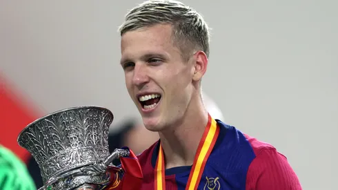 Dani Olmo of FC Barcelona celebrates with the Supercopa de Espana winners' trophy during the trophy presentation after the Spanish Super Cup Final between Real Madrid and FC Barcelona at King Abdullah Sports City on January 12, 2025 in Jeddah, Saudi Arabia.