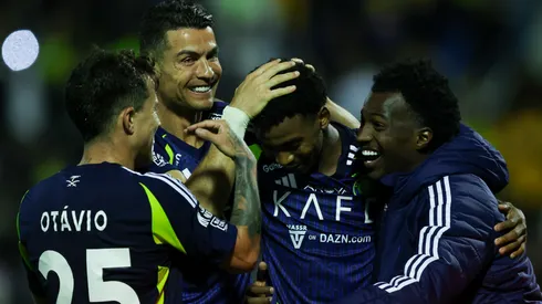 Cristiano Ronaldo of Al Nassr celebrates with teammate Saad Hagawi after scoring the 3rd goal during the Saudi Pro League match between Al Khaleej and Al Nassr at Prince Mohammed bin Fahad Stadium in Dammam on January 21, 2025 in Dammam, Saudi Arabia.