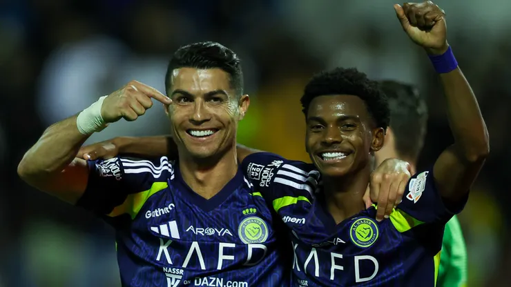 Cristiano Ronaldo of Al Nassr celebrates with teammate Saad Hagawi after scoring the 3rd goal during the Saudi Pro League match between Al Khaleej and Al Nassr at Prince Mohammed bin Fahad Stadium in Dammam on January 21, 2025 in Dammam, Saudi Arabia.