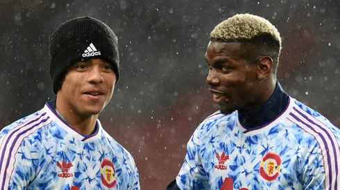 Mason Greenwood and Paul Pogba of Manchester United speak during the warm up prior to the Premier League match between Manchester United and Chelsea at Old Trafford on October 24, 2020 in Manchester, England.