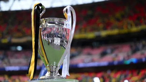 A detailed view of the UEFA Champions League Trophy, dressed in yellow and black ribbons to represent Borussia Dortmund and white ribbons to represent Real Madrid, on a plinth on the inside of the stadium prior to the UEFA Champions League 2023/24 Final match between Borussia Dortmund and Real Madrid CF at Wembley Stadium on June 01, 2024 in London, England.