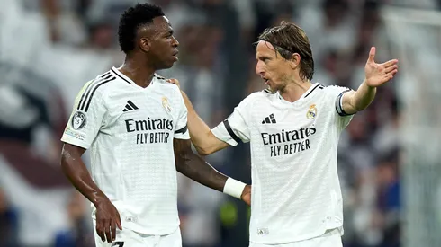 Vinicius Junior and Luka Modric of Real Madrid interact during the UEFA Champions League 2024/25 League Phase MD4 match between Real Madrid C.F. and AC Milan at Estadio Santiago Bernabeu on November 05, 2024 in Madrid, Spain.