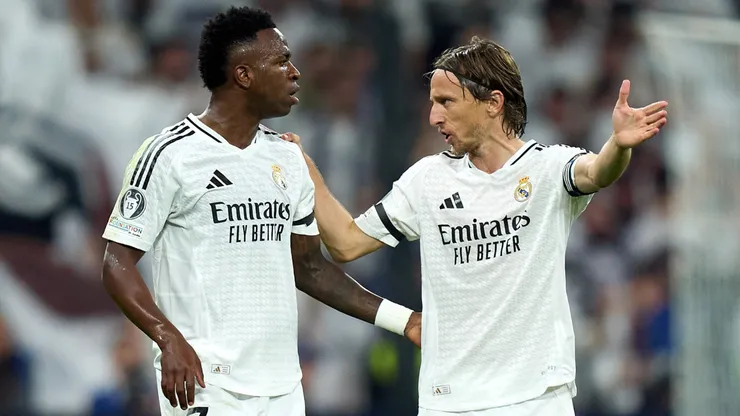 Vinicius Junior and Luka Modric of Real Madrid interact during the UEFA Champions League 2024/25 League Phase MD4 match between Real Madrid C.F. and AC Milan at Estadio Santiago Bernabeu on November 05, 2024 in Madrid, Spain.