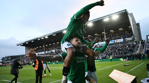 Lewis Gibson, Matthew Sorinola and Muhamed Tijani of Plymouth Argyle celebrate victory after the Emirates FA Cup Fourth Round match between Plymouth Argyle and Liverpool at Home Park on February 09, 2025 in Plymouth, England.