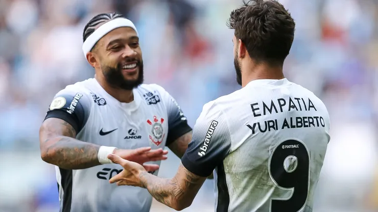 Yuri Alberto and Memphis Depay of Corinthians celebrate after scoring a goal.