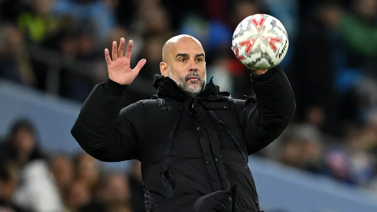 Pep Guardiola, Manager of Manchester City, catches the ball during the Emirates FA Cup Fifth Round match between Manchester City and Plymouth Argyle at Etihad Stadium on March 01, 2025 in Manchester, England.