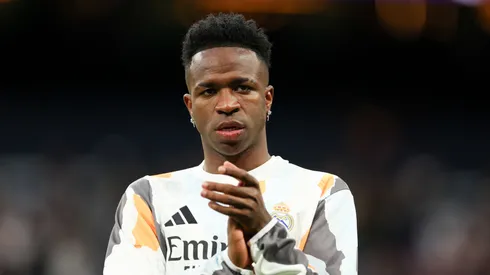 Vinicius Junior of Real Madrid acknowledges the fans during the warm up prior to the LaLiga match between Real Madrid CF and Rayo Vallecano at Estadio Santiago Bernabeu on March 09, 2025 in Madrid, Spain.