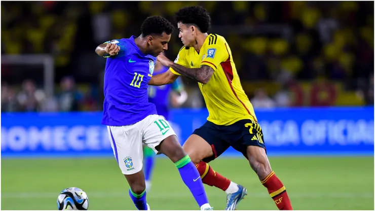 Rodrygo of Brazil battles for possession with Luis Diaz of Colombia