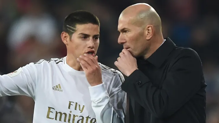 James Rodriguez of Real Madrid talks with his manager Zinedine Zidane during the Copa del Rey Quarter Final at Estadio Santiago Bernabeu on February 06, 2020 in Madrid, Spain.