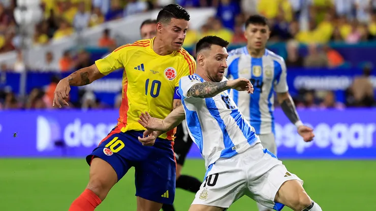 James Rodriguez of Colombia battles for possession with Lionel Messi of Argentina during the CONMEBOL Copa America 2024 Final match between Argentina and Colombia at Hard Rock Stadium on July 14, 2024 in Miami Gardens, Florida.