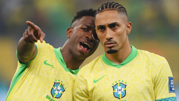 Vinicius Junior and Raphinha of Brazil talk as they line up prior to the South American FIFA World Cup 2026 Qualifier match between Brazil and Uruguay at Arena Fonte Nova on November 19, 2024 in Salvador, Brazil.