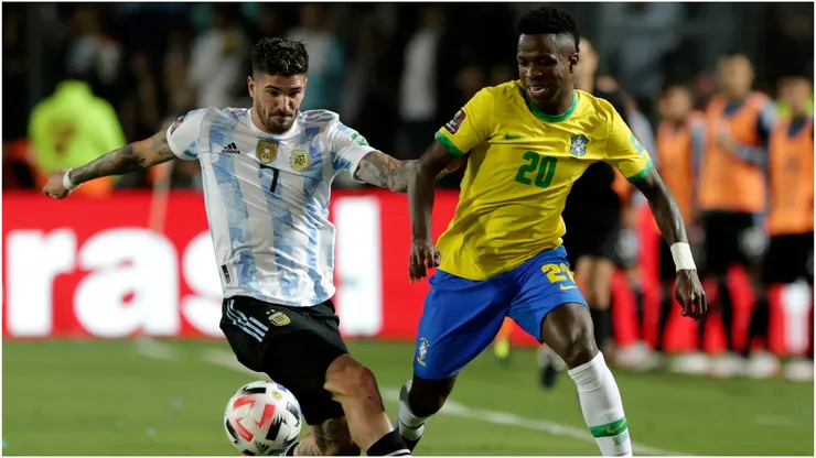 Rodrigo De Paul of Argentina competes for the ball with Vinicius Junior of Brazil