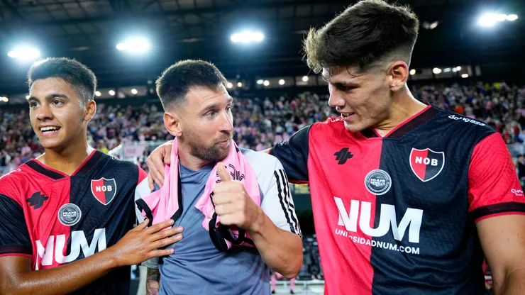 Lionel Messi #10 of Inter Miami CF greets Esteban Fernández #36 and Franco Diaz #15 of Newell's Old Boys after their friendly match at DRV PNK Stadium on February 15, 2024 in Fort Lauderdale, Florida.
