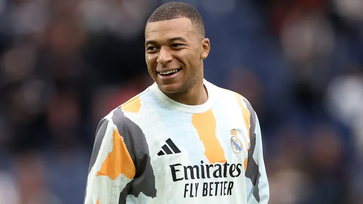 Kylian Mbappe of Real Madrid smiles during the warm up prior to the LaLiga match between Real Madrid CF and Valencia CF at Estadio Santiago Bernabeu on April 05, 2025 in Madrid, Spain.