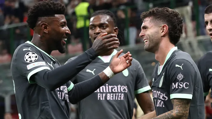Christian Pulisic of AC Milan celebrates after scoring the opening goal with his team-mate Emerson Royal during the UEFA Champions League 2024/25 League Phase MD3 match between AC Milan and Club Brugge KV at Stadio San Siro on October 22, 2024 in Milan, Italy