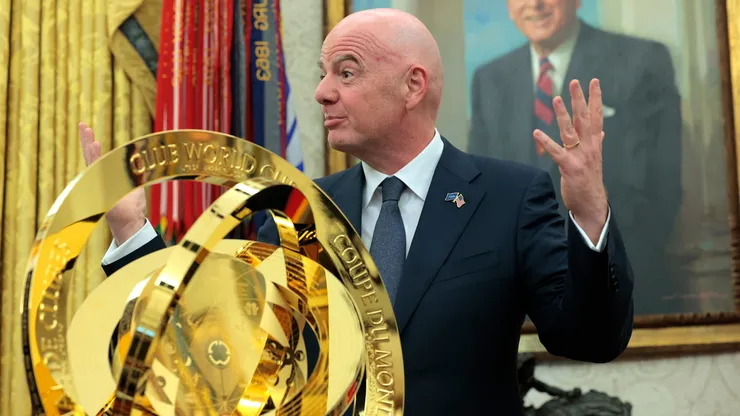 President of Fédération Internationale de Football Association (FIFA) Gianni Infantino (R) unveils the Club World Cup trophy alongside U.S. President Donald Trump in the Oval Office at the White House on March 07, 2025 in Washington, DC. President Trump signed an executive order establishing a White House Task Force for the 2026 World Cup.