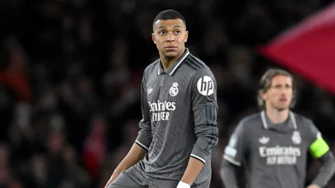 Kylian Mbappe of Real Madrid looks on as he prepares to restart play after Declan Rice of Arsenal (not pictured) scores his team's first goal during the UEFA Champions League 2024/25 Quarter Final First Leg match between Arsenal FC and Real Madrid C.F. at Emirates Stadium on April 08, 2025 in London, England.