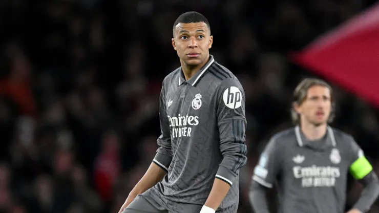 Kylian Mbappe of Real Madrid looks on as he prepares to restart play after Declan Rice of Arsenal (not pictured) scores his team's first goal during the UEFA Champions League 2024/25 Quarter Final First Leg match between Arsenal FC and Real Madrid C.F. at Emirates Stadium on April 08, 2025 in London, England.