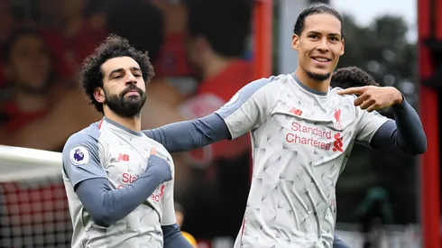 Mohamed Salah of Liverpool celebrates after scoring his team's first goal with Virgil van Dijk of Liverpool