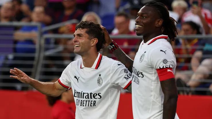 Christian Pulisic of AC Milan celebrates with teammate Rafael Leao