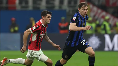 Nicolo’ Barella of FC Internazionale is pressured by Christian Pulisic of AC Milan