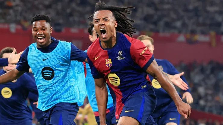 Jules Kounde of FC Barcelona celebrates scoring his team's third goal with team mates during the Copa del Rey Final match between FC Barcelona and Real Madrid at Estadio de La Cartuja on April 26, 2025 in Seville, Spain.