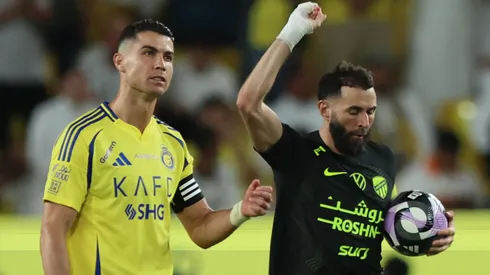 Karim Benzema of Al-Ittihad celebrates scoring his team's first goal as Cristiano Ronaldo of Al Nassr reacts during the Saudi Pro League match between Al Nassr and Al Ittihad at Al-Awwal Park on May 07, 2025 in Riyadh, Saudi Arabia.