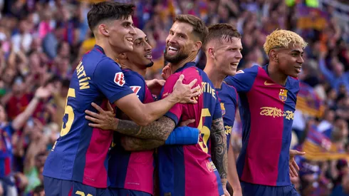 Raphinha (2nd L) of FC Barcelona celebrates with his teammates Gerard Martin, Inigo Martinez, Dani Olmo and Lamine Yamal after scoring their team's fourth goal during the LaLiga match between FC Barcelona and Real Madrid CF at Estadi Olimpic Lluis Companys on May 11, 2025 in Barcelona, Spain.