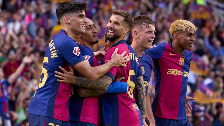 Raphinha (2nd L) of FC Barcelona celebrates with his teammates Gerard Martin, Inigo Martinez, Dani Olmo and Lamine Yamal after scoring their team's fourth goal during the LaLiga match between FC Barcelona and Real Madrid CF at Estadi Olimpic Lluis Companys on May 11, 2025 in Barcelona, Spain.