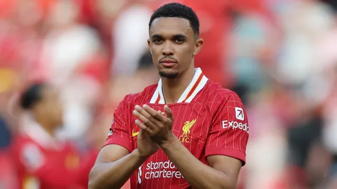 Trent Alexander-Arnold of Liverpool applauds the fans after the draw in the Premier League match between Liverpool FC and Arsenal FC at Anfield on May 11, 2025 in Liverpool, England.