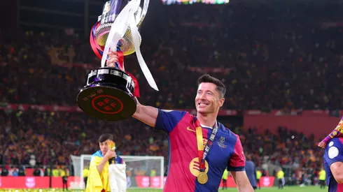 Robert Lewandowski of FC Barcelona celebrates with the Copa del Rey trophy after the team's victory in the Copa del Rey Final match between FC Barcelona and Real Madrid at Estadio de La Cartuja on April 26, 2025 in Seville, Spain.