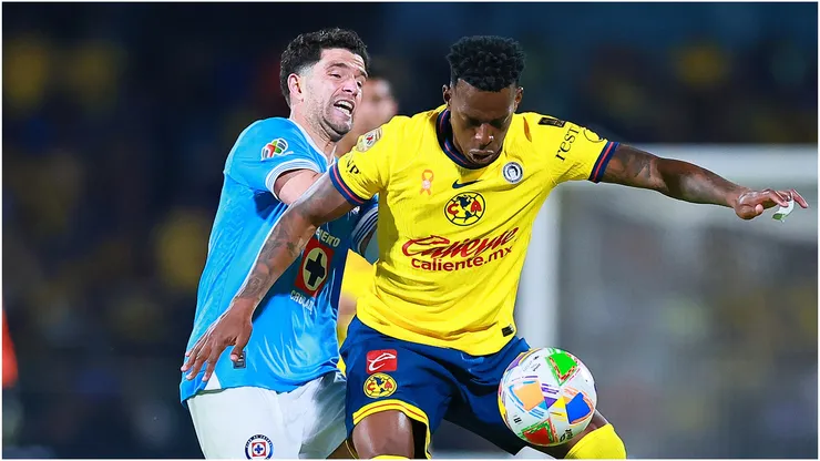Cristian Borja of America is put under pressure by Jose Rivero of Cruz Azul