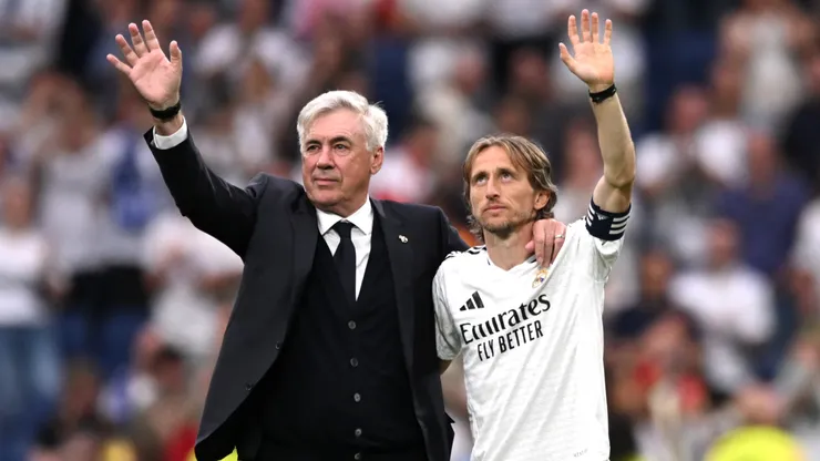 Carlo Ancelotti, Head Coach of Real Madrid, acknowledges the fans with Luka Modric following his final appearance for Real Madrid after the LaLiga match between Real Madrid CF and Real Sociedad at Estadio Santiago Bernabeu on May 24, 2025 in Madrid, Spain.