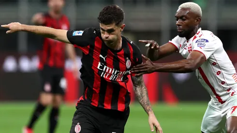 Christian Pulisic of AC Milan is challenged by Jean-Daniel Akpa Akpro of Monza during the Serie A match between AC Milan and Monza at Stadio Giuseppe Meazza on May 24, 2025 in Milan, Italy.