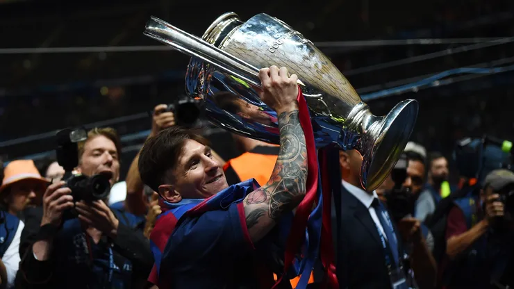 Lionel Messi of Barcelona celebrates with the UEFA Champions League trophy