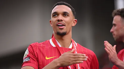 Trent Alexander-Arnold of Liverpool, celebrates after his final appearance for Liverpool as Liverpool are crowned the Champions of the Premier League for the 2024/25 Season, following the Premier League match between Liverpool FC and Crystal Palace FC at Anfield on May 25, 2025 in Liverpool, England.